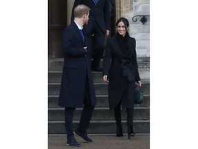Britain's Prince Harry and his fiancee Meghan Markle leave after a visit to Cardiff Castle in Cardiff, Wales, Thursday, Jan.18, 2018. During their tour, Prince Harry and Ms. Markle heard performances from musicians and poets, met sportsmen and women, and saw how organisations are working to promote Welsh language and cultural identity.