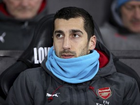 Arsenal's Henrikh Mkhitaryan looks on during the English Premier League soccer match between Swansea City and Arsenal at the Liberty Stadium, Swansea, Wales, Tuesday, Jan. 30, 2018.