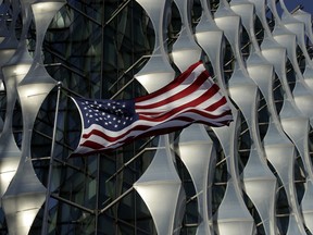 A U.S. flag flies outside the new United States Embassy building in London, Tuesday, Jan. 16, 2018. The new U.S. Embassy in London, denigrated last week by President Donald Trump as too expensive and in a poor location, is set to open to the public. The embassy, in the formerly industrial Nine Elms neighborhood, will open for public business Tuesday.