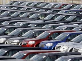 FILE - In this Friday Feb. 20, 2009 file photo, new Land Rover Freelander vehicles are stockpiled outside the Jaguar and Land Rover factory in Halewood, Liverpool, England. The British car industry association said Friday Jan. 5, 2017, that automobile sales in the country fell in 2017 for the first time in six years and are set to fall further this year largely because of subdued economic growth.
