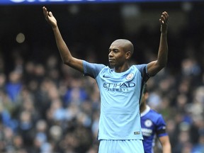 FILE - This is a Saturday, Dec. 3, 2016  file photo of Manchester City's Fernandinho  as he reacts during the English Premier League soccer match between Manchester City and Chelsea at the Etihad Stadium in Manchester, England.  Brazil midfielder Fernandinho  Friday Jan. 19, 2018 has signed a two-year contract extension with Manchester City, two days after the Premier League leaders tied Argentina defender Nicolas Otamendi to a new deal. The 32-year-old Fernandinho's new contract runs through 2020. He joined City from Shakhtar Donetsk in 2013. Otamendi also signed a two-year extension that keeps him at City until 2022.