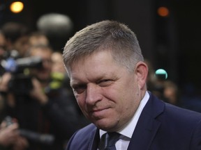 FILE - In this Friday, Oct. 20, 2017 file photo, Slovakia's Prime Minister Robert Fico arrives for an EU summit in Brussels. The prime ministers of Slovakia and the Czech Republic have marked the 25th anniversary of the peaceful split of Czechoslovakia by saying it set an example for any other country, including Spain and Catalonia.