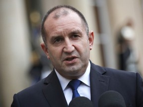 FILE- In this file photo dated Monday, Dec. 4, 2017, Bulgarian president Rumen Radev after a meeting with French President Emmanuel Macron, at the Elysee Palace, in Paris, France.  Bulgaria's president Radev on Tuesday Jan. 2, 2018, vetoed an anti-corruption law approved by Parliament, saying it's not strong enough to effectively combat corruption.