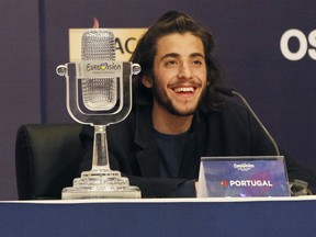 FILE - In this Saturday, May 13, 2017 file photo, Salvador Sobral from Portugal smiles as he speaks after winning the Final of the Eurovision Song Contest with his song "Amar pelos dois" during a press conference in Kiev, Ukraine. Salvador Sobral has left a Portuguese hospital after a successful heart transplant he underwent in December 2017.