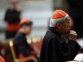 FILE - In this Wednesday, March 6, 2013 file photo, Cardinal Joseph Zen prays in St. Peter's Basilica during a vespers celebration at the Vatican. Hong Kong's retired cardinal has revealed the behind-the-scenes drama of the Vatican's efforts to improve relations with China, including its request for a legitimate bishop to resign in favor of an excommunicated one who is recognized by Beijing. Cardinal Joseph Zen, a vocal opponent of Pope Francis' opening to China, bitterly criticized the changing of the guard in Shantou diocese and said in a Facebook post Monday, Jan. 29, 2018 that he traveled to the Vatican Jan. 10 to personally discuss it with the pope.