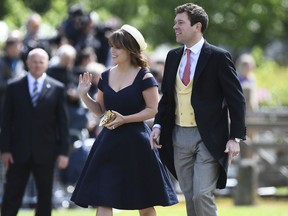 FILE - In this Saturday, May 20, 2017 file photo, Britain's Princess Eugenie and her partner Jack Brooksbank arrive for the wedding of Pippa Middleton and James Matthews at St Mark's Church in Englefield, England. Buckingham Palace said Monday Jan. 22, 2018, Princess Eugenie, the daughter of Prince Andrew and his ex-wife Sarah Ferguson, will marry Jack Brooksbank in Autumn 2018.