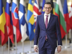 FILE - A Thursday, Dec. 14, 2017 file photo showing Polish Prime Minister, Mateusz Morawiecki, arriving for an EU summit at the Europa building in Brussels. Poland's new prime minister is looking to improve strained relations with partners in the European Union when he arrives in Brussels on Tuesday, Jan. 9. 2017. The Polish government's stance on justice reform and immigration has prompted so much unease within the EU that a procedure to strip the country of voting rights in the 28-nation bloc has been started.