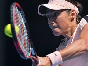 FILE - In this Monday, Jan. 22, 2018 file photo, France's Caroline Garcia makes a backhand return to United States' Madison Keys during their fourth round match at the Australian Open tennis championships in Melbourne, Australia. Fed Cup captain Yannick Noah has on Wednesday, Jan. 31, 2018 selected Kristina Mladenovic, Pauline Parmentier and Amandine Hesse for the first-round match against Belgium next month. Seventh-ranked Caroline Garcia and Alize Cornet will not take part in the Feb. 10-11 tie, however.