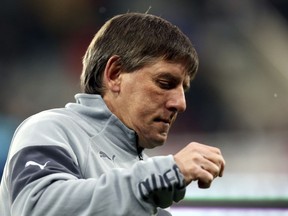 FILE - A Thursday, Jan. 1, 2015 file photo showing Newcastle United's Peter Beardsley ahead of their English Premier League soccer match between Newcastle United and Burnley at St James' Park, Newcastle, England. Former England international Peter Beardsley is stepping down from his role as under-23s coach at Newcastle it was announced Tuesday, JAN. 9, 2017, while being investigated over allegations of bullying and racism.
