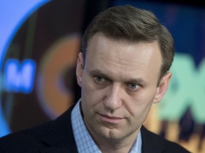 FILE - In this file photo dated Wednesday, Dec. 27, 2017, Russian opposition activist Alexei Navalny pauses, at the Echo Moskvy (Echo of Moscow) radio station in Moscow.  A Moscow district court on Monday Jan. 22, 2018, has ordered the closure of the foundation crucial to the failed election campaign of opposition leader Alexei Navalny.