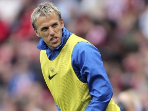 FILE - A Saturday, April 20, 2013 file photo showing Everton's Phil Neville, during their English Premier League soccer match against Sunderland at the Stadium of Light, Sunderland, England. Phil Neville has been hired as manager of England's women's team. Since retiring from playing in 2013, Neville has had brief spells as an assistant coach with the England Under-21 men's team, United and Valencia. He has also managed Salford City _ the semi-professional team he co-owns with other former United players _ for one game.