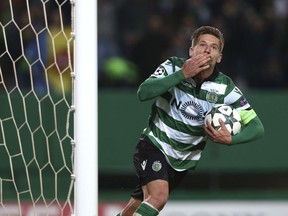 FILE - In this file photo dated Tuesday, Nov. 22, 2016, Sporting's Adrien Silva celebrates scoring during a Champions League, Group F soccer match between Sporting CP and Real Madrid at the Alvalade stadium in Lisbon. Leicester bought Silva from Sporting Lisbon on transfer deadline day in August 2017, but did not register the deal with FIFA on time, so now Monday Jan. 1, 2018, four months after signing, Silva is finally ready to play for the English Premier League club.