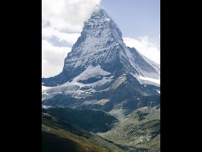FILE - A July 30 2011 file picture shows the famous Matterhorn mountain near Zermatt, Switzerland. Swiss authorities near the famed Matterhorn peak on Tuesday Jan. 9, 2018 closed ski slopes, hiking trails, cable cars, roads and train service into the nearby town of Zermatt amid a heightened risk of avalanches, stranding some 13,000 tourists in the town.