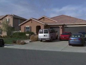 In this grab taken from video provided by KABC-TV on Tuesday, Jan. 16, 2018, the exterior of the home where police arrested a couple accused of holding their 13 children captive, in Perris, east of Los Angeles. Authorities say an emaciated teenager led deputies to a California home where her 12 brothers and sisters were locked up in filthy conditions, with some of them malnourished and chained to beds. (KABC-TV via AP)
