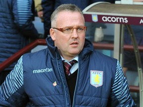 FILE - In this file photo dated Sunday, Nov. 2, 2014, Aston Villa manager Paul Lambert during the English Premier League soccer match against Tottenham Hotspur at Villa Park in Birmingham, England.  Stoke has hired Paul Lambert to manage the Premier League club, according to an announcement Monday Jan. 15, 2018.
