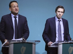 Ireland's Prime Mnister Leo Varadkar, left, and Minister for Health Simon Harris brief the media on the government's plans for a referendum on Ireland's restrictive abortion laws, following a specially convened cabinet meeting at Government Buildings in Dublin Monday Jan. 29, 2018. Ireland's health minister said Tuesday abortion is a reality for Irish women regardless of whether the country repeals a constitutional ban on most terminations at a planned referendum in May.