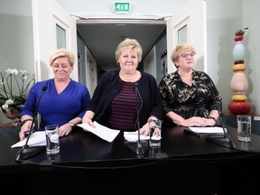 Prime Minister of Norway, Erna Solberg, center, Minister of Finance Siv jensen, left, and Trine Skei Grande, leader of The Liberal Party of Norway, right, at a Press Conference at Jeloy, Norway, Sunday Jan. 14. 2018. Norway's current two-party center-right government has agreed to include the small centrist Liberal Party in the Cabinet after lengthy talks but the expanded three-way government will still fall short of majority in the parliament.