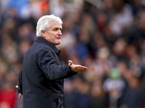 Stoke City manager Mark Hughes gestures on the touchline during the match against Newcastle United, during their English Premier League soccer match at the bet365 Stadium in Stoke, England, Monday Jan. 1, 2018.
