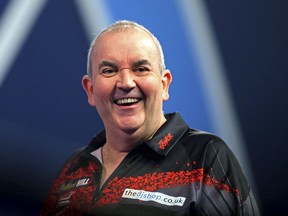 Britain's Phil Taylor reacts prior to his final match against Britain's Rob Cross, during day fifteen of the World Darts Championship at Alexandra Palace, in London, Monday, Jan. 1, 2018.