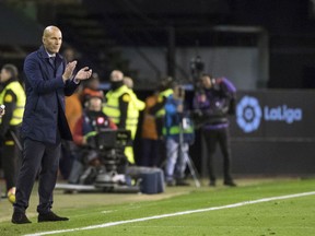 Madrid's coach Zinedine Zidane gestures during a Spanish La Liga soccer match between RC Celta and Real Madrid at the Balaidos stadium in Vigo, Spain, Sunday, Jan. 7, 2018.