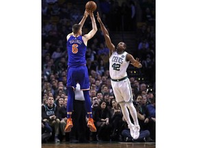 Boston Celtics forward Al Horford (42) leaps as he tries to block a shot by New York Knicks forward Kristaps Porzingis (6) during the first quarter of an NBA basketball game in Boston, Wednesday, Jan. 31, 2018.