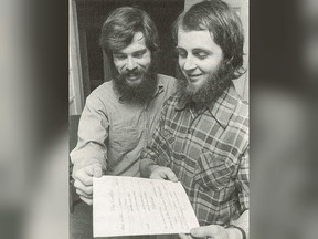 Chris Vogel (left) and Richard North look over their marriage certificate in a 1974 handout photo.