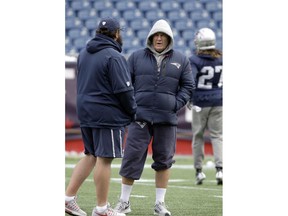 New England Patriots head coach Bill Belichick, center, speaks with defensive coordinator Matt Patricia, left, during NFL football practice, Tuesday, Jan. 9, 2018, at Gillette Stadium, in Foxborough, Mass. The Patriots are scheduled to host the Tennessee Titans in an AFC divisional NFL football playoff game o Saturday in Foxborough.
