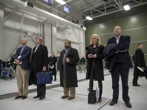 White House Director of Legislative Affairs Marc Short, left, Vice President Mike Pence's Chief of Staff Nick Ayers, second from right, Counselor to the President Kellyanne Conway, third from right, and National Economic Council chairman Gary Cohn, second from right, listen and President Donald Trump and Republican congressmen speak at a news conference after participating in a Congressional Republican Leadership Retreat at Camp David, Md., Saturday, Jan. 6, 2018.