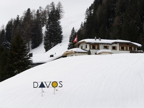 FILE - In this Jan. 12, 2018 file photo a sign reading "Davos", pictured prior to the World Economic Forum WEF in Davos, Switzerland. WEF says international security, the environment and the global economy will be mind at the 48th annual meeting of business leaders, civil society advocates, academics, artistic celebrities and others in the Swiss Alpine resort from Jan. 23-26.