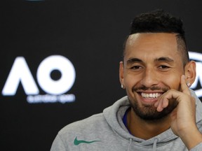 Australia's Nick Kyrgios smiles during a press conference at the Australian Open tennis championships in Melbourne, Australia, Saturday, Jan. 13, 2018.