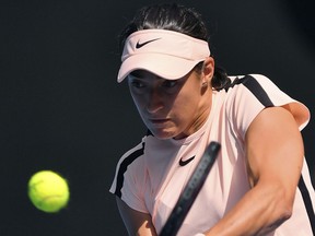 France's Caroline Garcia hits a forehand return to United States' Madison Keys during their fourth round match at the Australian Open tennis championships in Melbourne, Australia Monday, Jan. 22, 2018.