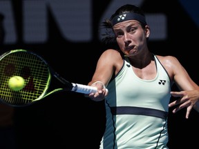 Latvia's Anastasija Sevastova makes a forehand return to Russia's Maria Sharapova during their second round match at the Australian Open tennis championships in Melbourne, Australia, Thursday, Jan. 18, 2018.