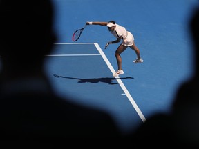 France's Caroline Garcia serves to United States' Madison Keys during their fourth round match at the Australian Open tennis championships in Melbourne, Australia Monday, Jan. 22, 2018.