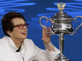 Billie Jean King, former ladies singles champion holds the Daphne Akhurst Memorial Cup during a press conference ahead of the Australian Open tennis championships in Melbourne, Australia Friday, Jan. 12, 2018. King is in Melbourne to celebrate the 50th anniversary of her Australian Open victory.