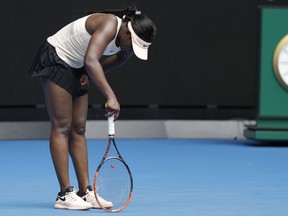 United States' Sloane Stephens bends over while playing China's Zhang Shuai during their first round match at the Australian Open tennis championships in Melbourne, Australia, Monday, Jan. 15, 2018.