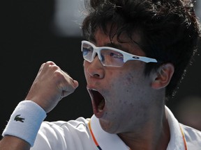 South Korea's Chung Hyeon reacts after winning a point against Germany's Alexander Zverev during their third round match at the Australian Open tennis championships in Melbourne, Australia, Saturday, Jan. 20, 2018.