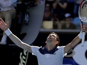 Serbia's Novak Djokovic reacts after defeating United States' Donald Young during their first round match at the Australian Open tennis championships in Melbourne, Australia, Tuesday, Jan. 16, 2018.