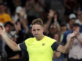 United States' Tennys Sandgren celebrates after defeating Austria's Dominic Thiem in their fourth round match at the Australian Open tennis championships in Melbourne, Australia, Monday, Jan. 22, 2018.