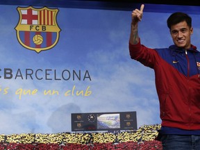 Brazilian soccer player Philippe Coutinho Correia poses for the media at the Camp Nou stadium in Barcelona, Spain, Sunday, Jan. 7, 2018. Philippe Coutinho is joining Barcelona after Liverpool agreed Saturday to sell the Brazilian in a deal that makes him one of the most expensive players in soccer history.