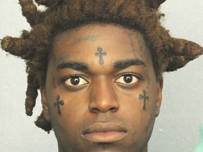 This Thursday, Jan. 18, 2018 arrest photo provided by the Broward County Sheriff's Office, Fla., shows Dieuson Octave, also known as the rapper Kodak Black. Octave has been ordered held without bond on Friday, Jan 19, 20187, facing seven felony charges that include child neglect and drug possession.  He is also charged with grand theft of a firearm, possession of a firearm by a convicted felon.  Broward Judge Joel Lazarus ordered him held in jail because he was already on probation. (Broward County Sheriff's Office via AP)