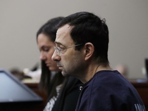 Dr. Larry Nassar is seated during the seventh day of his sentencing hearing Wednesday, Jan. 24, 2018, in Lansing, Mich. Nassar has admitted sexually assaulting athletes when he was employed by Michigan State University and USA Gymnastics, which is the sport's national governing organization and trains Olympians.