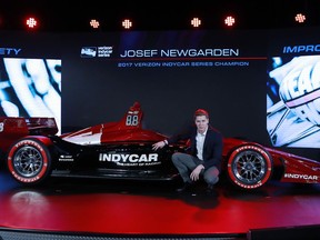 Josef Newgarden, 2017 Verizon IndyCar Series champion, describes the advantages of the new race car setup during the North American International Auto Show, Tuesday, Jan. 16, 2018, in Detroit.