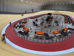 In a photo from Thursday, Jan. 18, 2018, riders cycle in the Lexus Velodrome in Detroit. The indoor cycling track is expected to draw bike riders from other cold-weather states and across the U.S. while giving inner-city youth an opportunity to participate for free in the fast-moving and growing sport. The Lexus Velodrome joins a training facility in Colorado Springs and a venue in Los Angeles as the only indoor velodromes in the U.S.