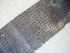 This Friday, May 10, 2013 photo shows the ten commandments written on one of the Dead Sea Scrolls in Jerusalem.