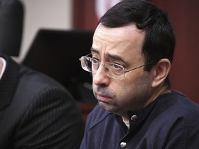 Larry Nassar looks at the gallery in the court during the sixth day of his sentencing hearing Tuesday, Jan. 23, 2018, in Lansing, Mich. Nassar has admitted sexually assaulting athletes when he was employed by Michigan State University and USA Gymnastics, which is the sport's national governing organization and trains Olympians.