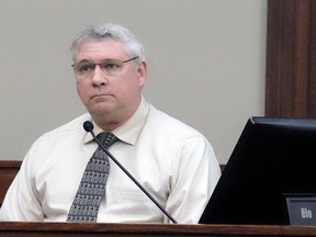 Jeffrey Howenstine listens in Ingham County Circuit Court, Wednesday, Jan. 17, 2018 in Lansing, Mich. The former Michigan middle school band teacher acquitted in 2002 of sexual conduct involving a student has pleaded guilty in a separate case to attempting to engage a minor for prostitution.