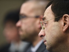 A tear falls from Larry Nassar's eye Friday, Jan. 19, 2018, as he is confronted  in Circuit Judge Rosemarie Aquilina's courtroom during the fourth day of victim impact statements regarding former sports medicine doctor Larry Nassar, who pled guilty to seven counts of sexual assault in Ingham County, and three in Eaton County.