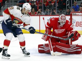 Detroit Red Wings goaltender Jimmy Howard (35) stops a shot from Florida Panthers center Aleksander Barkov (16) in the first period of an NHL hockey game Friday, Jan. 5, 2018, in Detroit.