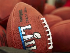 Official balls for the NFL Super Bowl LII football game are seen at the Wilson Sporting Goods Co. in Ada, Ohio, Monday, Jan. 22, 2018. The New England Patriots will play the Philadelphia Eagles in the Super Bowl on Feb. 4, in Minneapolis, MN.