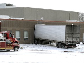 A semitrailer is embedded in the side of Lyle Public School Tuesday morning, Jan. 16, 2018 after it veered off a highway and crashed through the wall of the elementary school in Lyle, Minnesota. The semi left Highway 218 in Lyle after trying to avoid a car making a turn, striking it in the right rear of the vehicle.